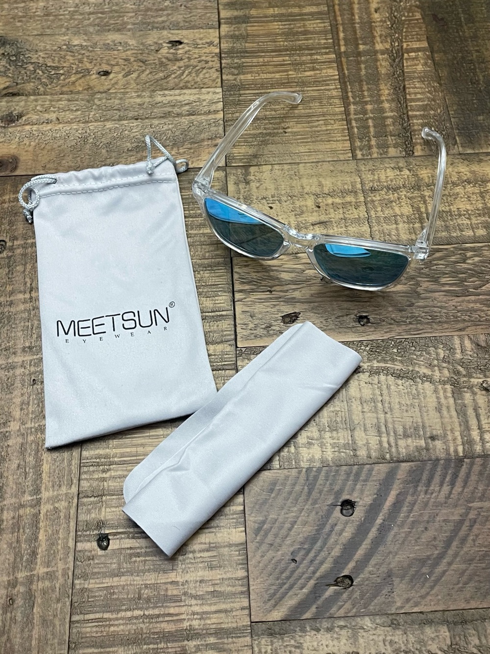 MEET SUN Polarized Sunglasses with clear frames and blue mirrored lenses